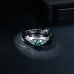 CARISSIE round moissanite solitaire ring, top-down perspective showing the eye-shaped design with central blue-green stone flanked by pavé details