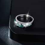 CARISSIE marquise moissanite bezel engagement ring, high-angle detail shot resting on a black display stand to show depth