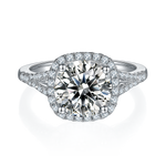 CARISSIE round moissanite halo engagement ring, top-down view showcasing brilliant center stone surrounded by diamond halo and prongs