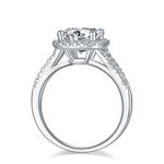 CARISSIE round moissanite halo engagement ring, side profile revealing open gallery structure and pavé detailing on the inner shank