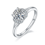 CARISSIE round moissanite solitaire ring, angled view highlighting crescent pavé gallery and polished silver-tone band