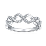 CARISSIE round moissanite pavé wedding band, front view showing the wavy infinity design with sparkling stones on white metal.