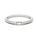 CARISSIE Baguette Moissanite Pavé Eternity Band, low angle shot emphasizing the ring's silhouette and polished metal finish