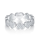 CARISSIE eternity band, inverted perspective highlighting the polished inner surface of the heart links and the detailed outer stone setting