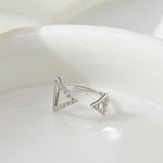 CARISSIE round moissanite pavé engagement ring, solo silver-tone version on white dish displaying the hollow triangular terminal