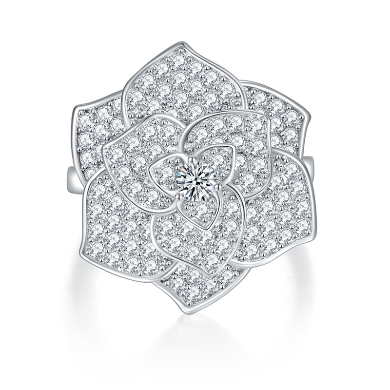 CARISSIE floral statement ring, top-down view highlighting the full diamond-encrusted bloom and central round gemstone