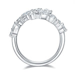 CARISSIE mixed-cut moissanite bypass ring, side profile highlighting the prong settings and smooth polished inner band