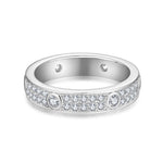 CARISSIE round moissanite eternity band, front view displaying continuous double row of small stones with larger accents