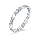 CARISSIE round moissanite eternity band, angled view highlighting the zig-zag profile and hexagonal stone settings