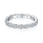 CARISSIE round moissanite eternity band, interior perspective revealing open galleries and stone settings within the geometric segmented structure