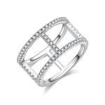CARISSIE round moissanite pavé statement ring, angled view highlighting the geometric openwork cage and sparkling stone frame
