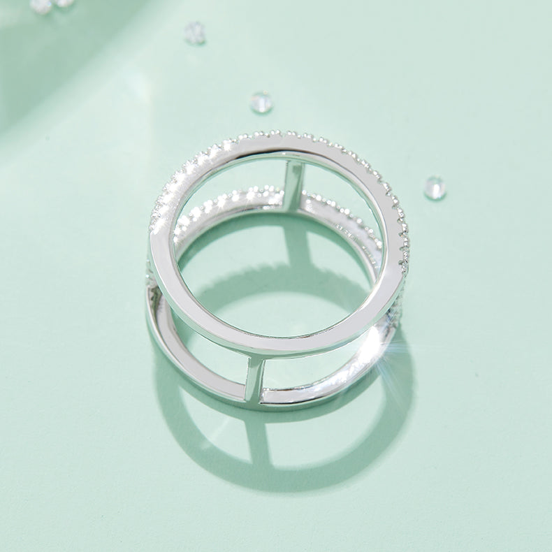 CARISSIE round moissanite pavé statement ring, top-down perspective revealing the circular band layout and internal metal connectors