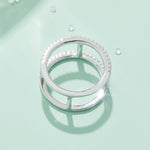 CARISSIE round moissanite pavé statement ring, top-down perspective revealing the circular band layout and internal metal connectors