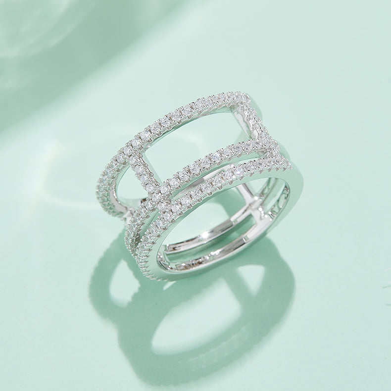 CARISSIE round moissanite pavé statement ring, lifestyle shot on mint green surface casting a soft shadow
