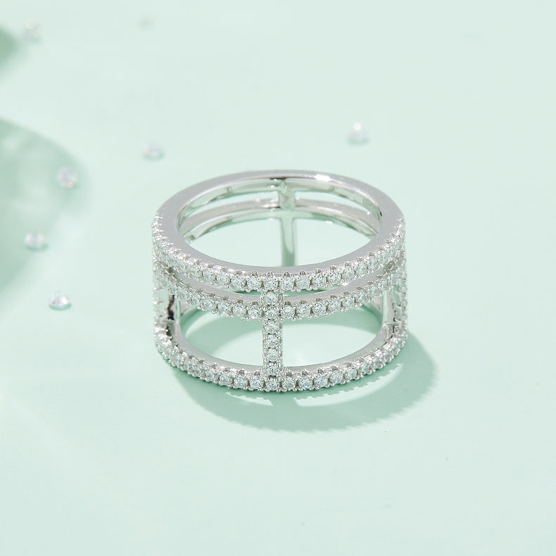 CARISSIE round moissanite pavé statement ring, front view surrounded by loose stones to showcase brilliance and sparkle