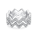 CARISSIE round moissanite pavé statement ring, front view showing the bold chevron design with openwork silver-tone metal
