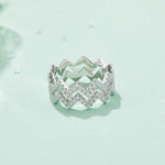 CARISSIE round moissanite pavé statement ring, lifestyle shot on mint green surface displaying the full width of the band