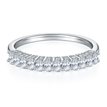 CARISSIE round moissanite eternity band, front profile displaying uniform stone size and secure prong placement across the top
