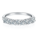 CARISSIE round moissanite eternity band, front profile highlighting vertical prongs and brilliant-cut stone details