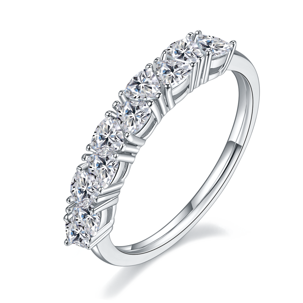 CARISSIE round moissanite eternity band, angled view highlighting the four-prong setting and polished silver-tone shank.
