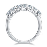 CARISSIE oval moissanite eternity band, top-down profile view highlighting the continuous row of prong-set stones and smooth inner band surface