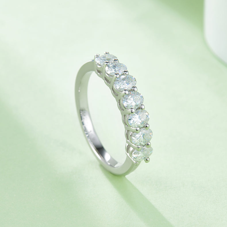 CARISSIE oval moissanite eternity band, side-angle perspective emphasizing the medium-profile band height and alignment of round moissanites