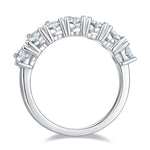 CARISSIE heart moissanite eternity band, top-down perspective revealing the uniform arrangement of stones and geometric metal bars.