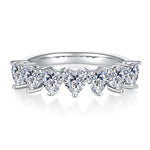 CARISSIE heart moissanite eternity band, front profile showing a continuous row of downward-pointing heart stones in white metal.