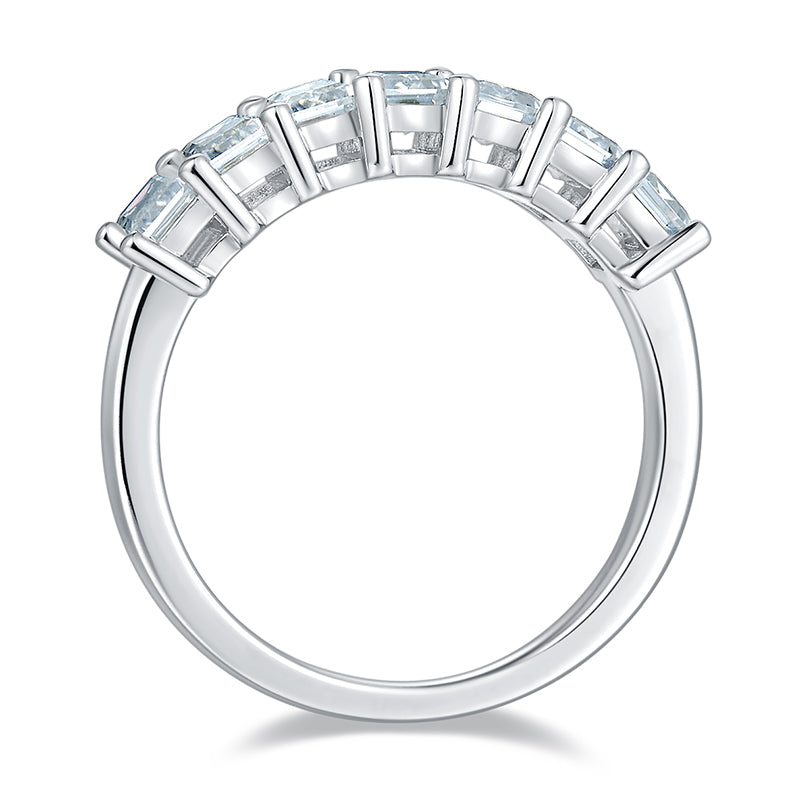CARISSIE emerald cut moissanite wedding band, front view showing continuous row of rectangular stones in dual-prong setting