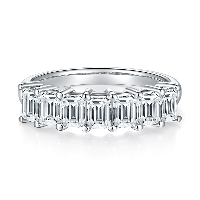 CARISSIE emerald cut moissanite ring, top-down view revealing the precise alignment of stones and four-prong setting style
