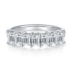CARISSIE emerald cut moissanite ring, top-down view revealing the precise alignment of stones and four-prong setting style