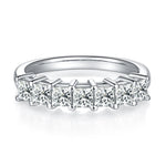 CARISSIE princess moissanite eternity band, front profile showing polished silver-tone shank and stone row