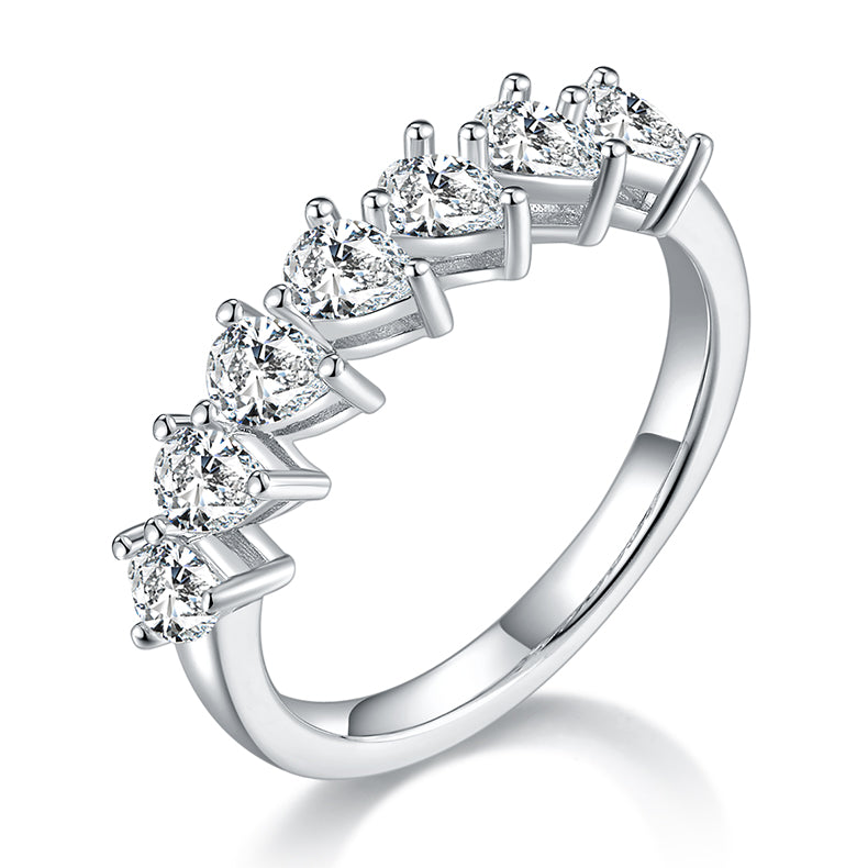 CARISSIE pear moissanite eternity band, angled view showing seven prong-set stones and polished silver-tone metal