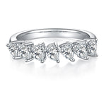 CARISSIE pear moissanite eternity band, front profile highlighting the curved row of sparkling stones in a sleek setting