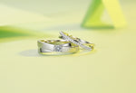 CARISSIE round moissanite pavé eternity band set, stacked arrangement on yellow surface emphasizing modern textures