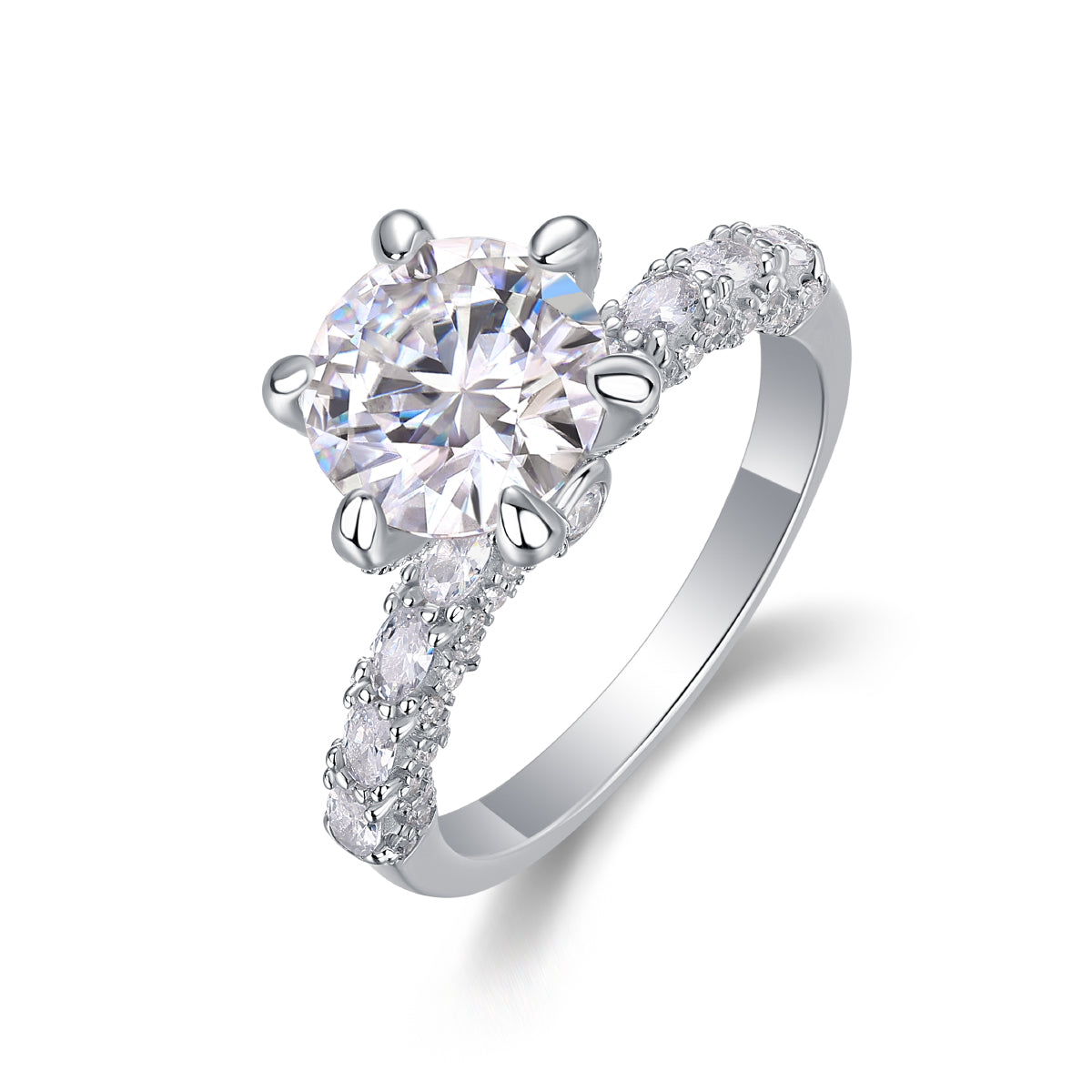 CARISSIE round moissanite solitaire ring, angled view highlighting six-prong setting and pavé marquise shoulder stones