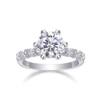 CARISSIE round moissanite solitaire ring, front view displaying brilliant center stone and split-shank band details