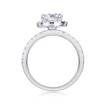 CARISSIE pear moissanite halo ring, side profile view revealing the height of the prong setting and pavé stones along the shank