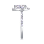 CARISSIE pear moissanite halo ring, vertical side angle emphasizing the row of pave-set diamonds extending down the metal band