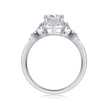 CARISSIE round moissanite halo engagement ring bottom profile view, revealing the open gallery work and smooth interior of the white gold band
