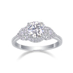 CARISSIE round moissanite halo engagement ring front view, displaying four-prong setting and polished silver band