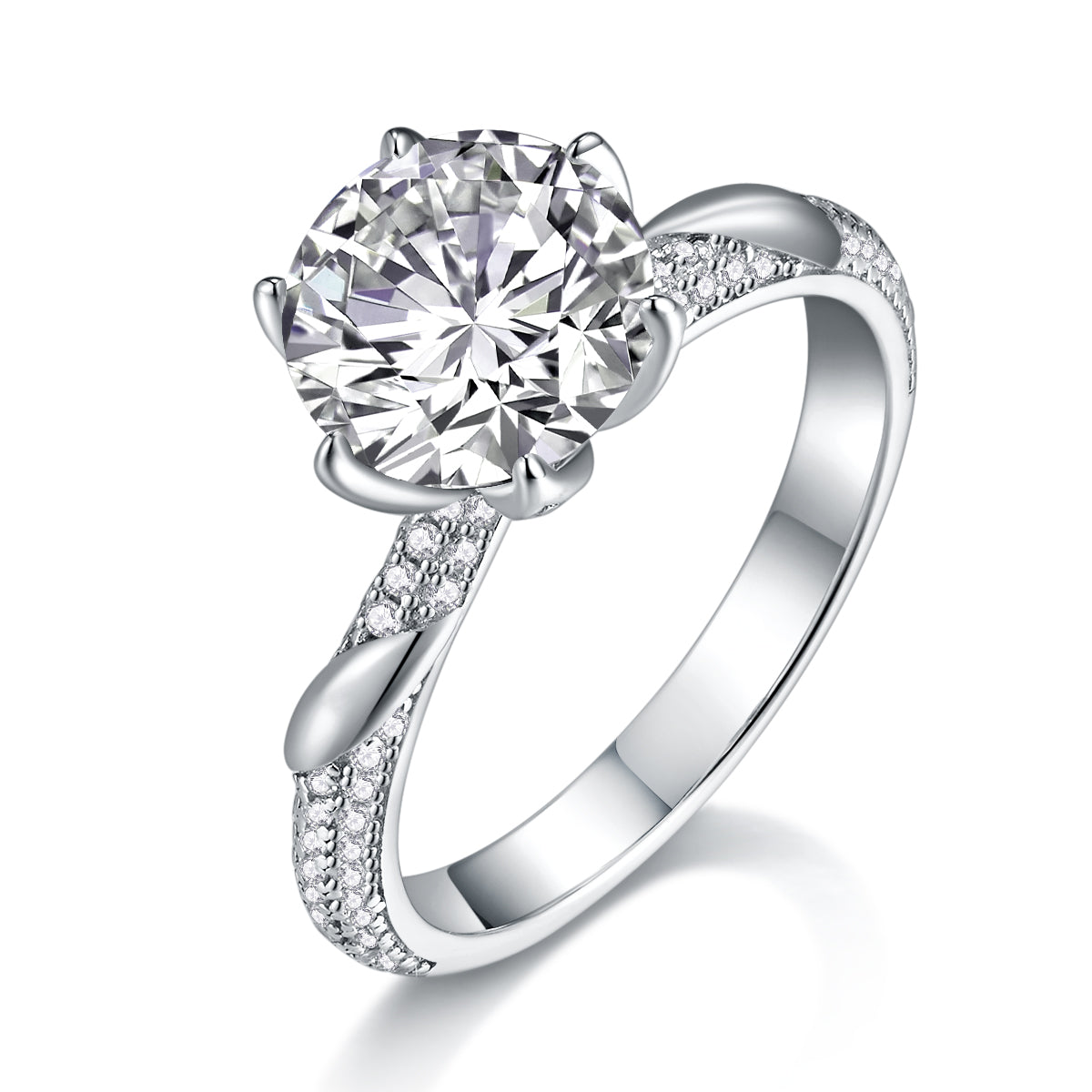 CARISSIE round moissanite solitaire ring angled view showing leaf-like prongs and pavé stones on the split shank shoulders