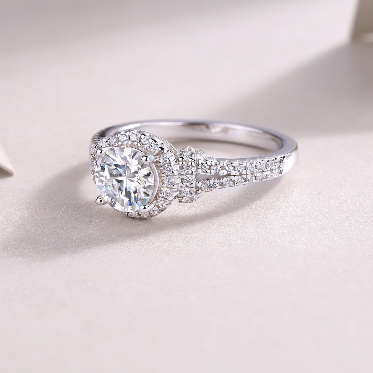 CARISSIE round moissanite engagement ring three-quarter view emphasizing the double row of diamonds along the split band