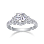 CARISSIE round moissanite halo ring angled studio shot displaying the triple-row diamond effect and silver-tone metal finish