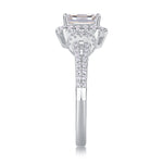 CARISSIE emerald cut moissanite halo ring side profile, emphasizing gallery work and shoulder stones