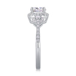 CARISSIE round moissanite halo ring, top-down view showcasing the four-prong setting and symmetrical arrangement of accent stones