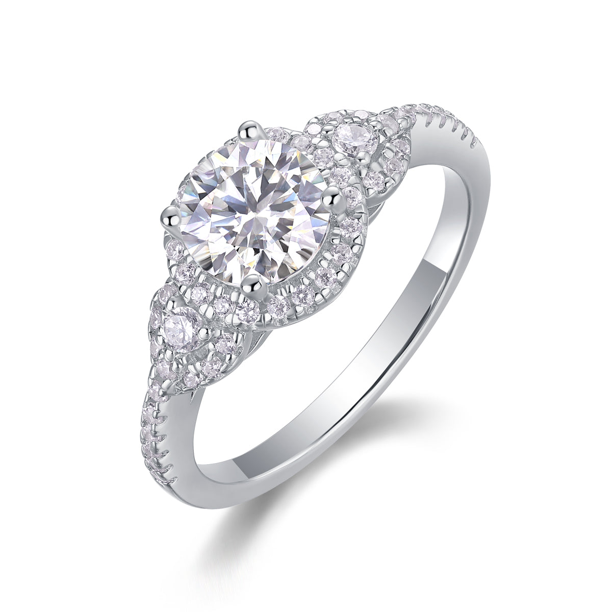 CARISSIE round moissanite halo engagement ring, angled view displaying the swirling pavé design and polished silver-tone band