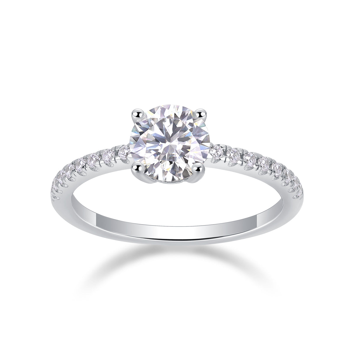 CARISSIE round moissanite solitaire ring studio shot, three-quarter angle displaying brilliant-cut stone and half-pavé shank