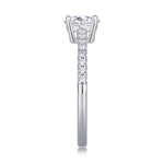 CARISSIE round moissanite solitaire ring side profile, emphasizing the straight line of pavé stones leading to the gallery rail