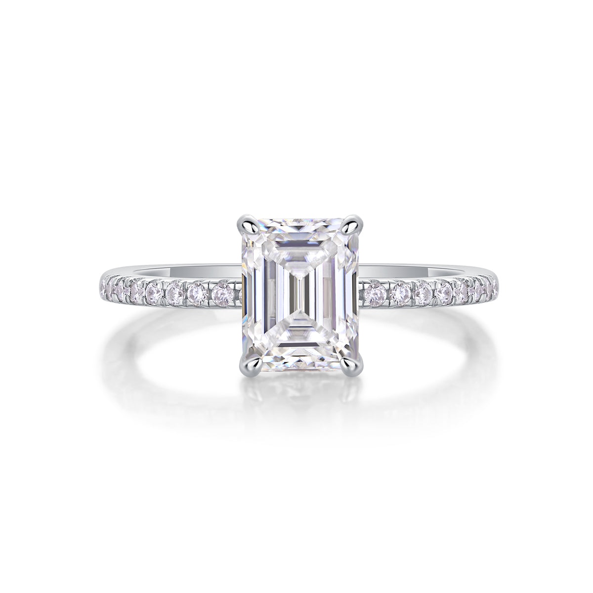 CARISSIE engagement ring straight-on angle, revealing gallery accent stones beneath the elevated emerald cut center